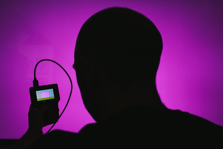 Silhouette of a person using a Murideo Six-G Analyzer.